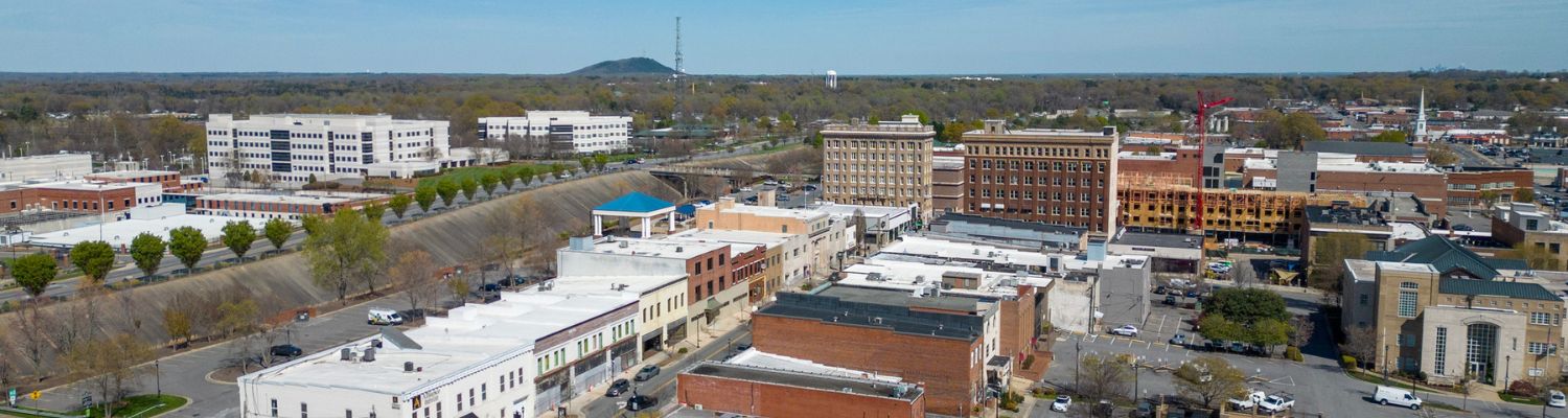 Local introductory image welcoming visitors to Real Property Management Queen City