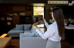 Property manager in a rental home creating a virtual showing of the home using a tablet 