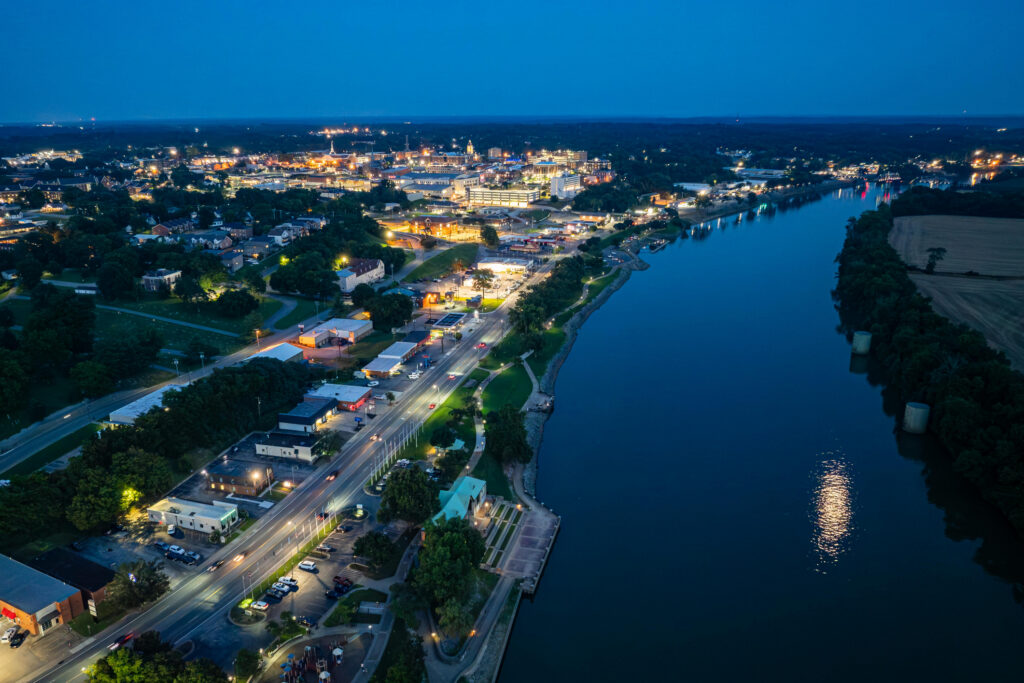 Aerial Clarksville, Tennessee skyline and Cumberland River at night.