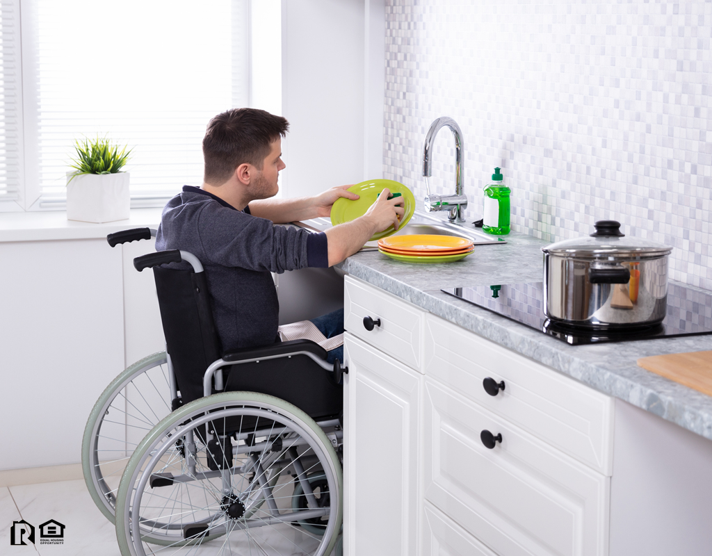Paramount Cleaning Dishes in the Kitchen from His Wheelchair