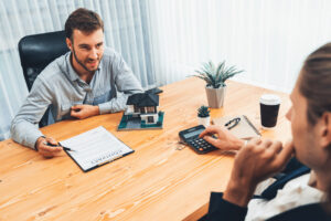 Property manager and tenant discuss the lease and rent payment methods.
