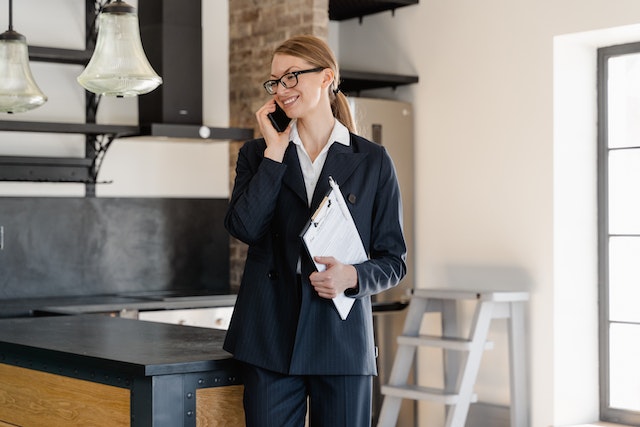 a-person-standing-in-a-property-talking-on-the-phone
