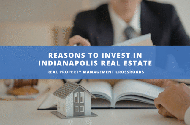 A miniature model house sits on a book, symbolizing real estate investment. A suited person reviews documents in the background. Text: "Reasons to Invest in Indianapolis Real Estate."