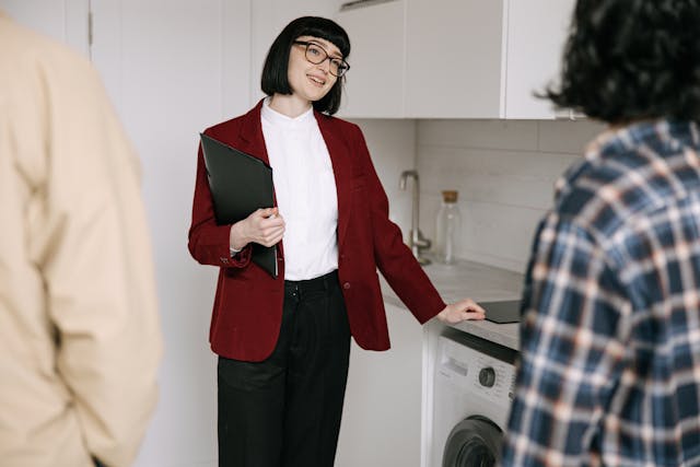 a-landlord-conducting-a-property-showing-with-two-tenants