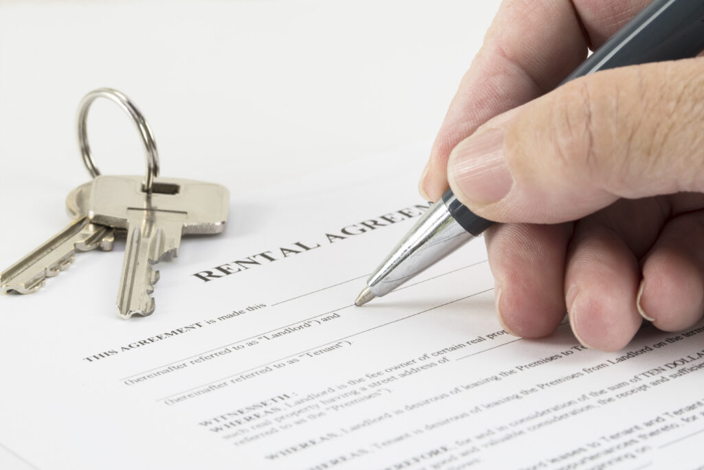 a person signing a lease agreement