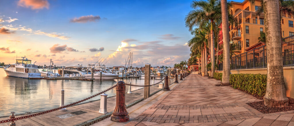 Sunset over the boats in Esplanade Harbor Marina in Marco Island