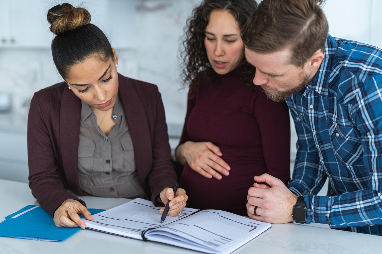 Young Couple Discussing Money with a Financial Advisor