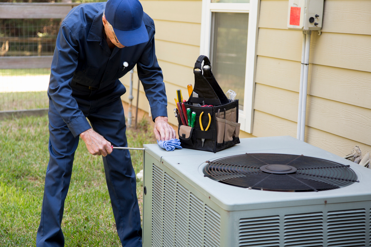 HVAC Technician Servicing an Air Conditioning Unit