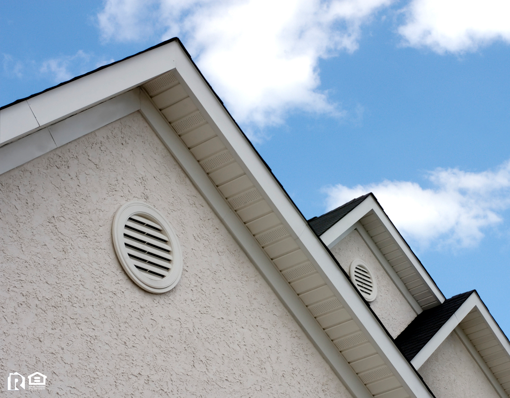 Stucco Roof Peaks Against a Blue Sky