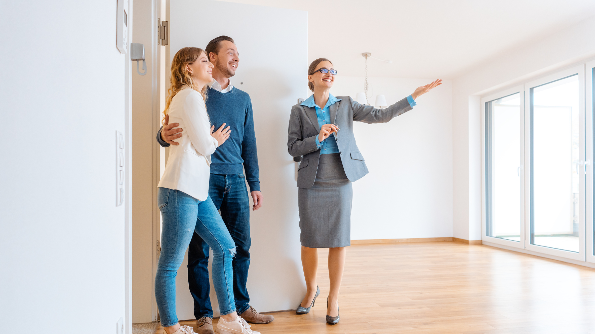 A property manager showing a couple an apartment