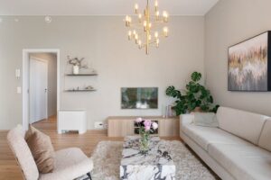a-beige-living-room-with-light-food-floors-and-a-white-couch