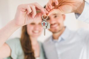 couple holding key