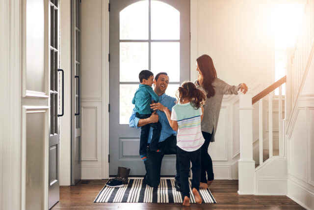 Happy, door and parents with children hug in home for greeting, welcome and bonding. Family, hello and mother, father and kids in house embrace for affection, relationship and excited for return Happy, door and parents with children hug in home for greeting, welcome and bonding. Family, hello and mother, father and kids in house embrace for affection, relationship and excited for return