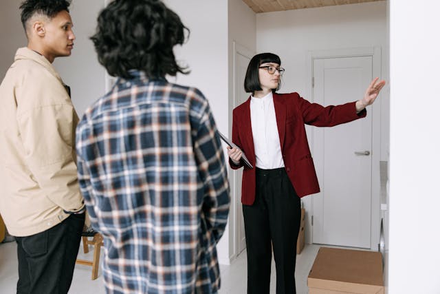 three-people-inspecting-property