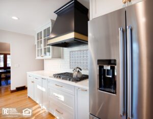 A clean bathroom featuring a sink, toilet, and a shower, all in a modern design.