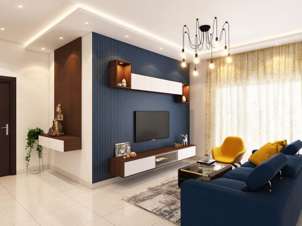 living room with blue feature wall, blue couch light floor