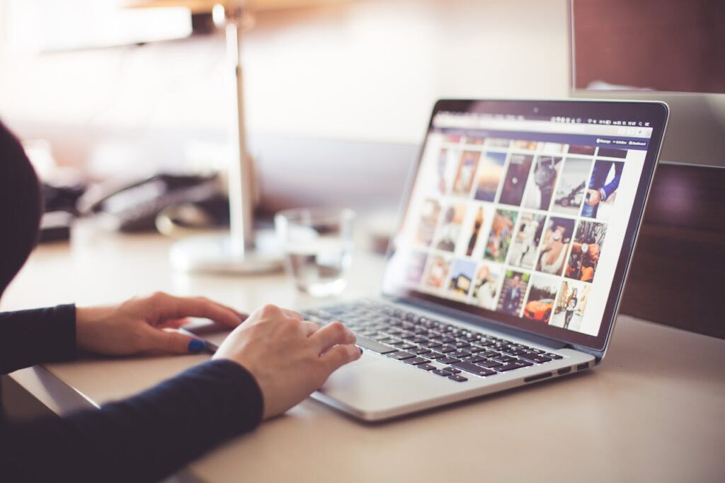person scrolling on computer
