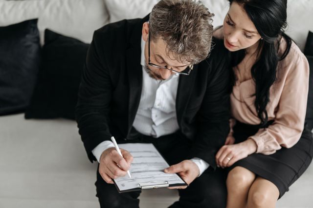 two people reviewing a document