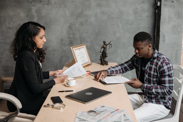 people exchanging documents