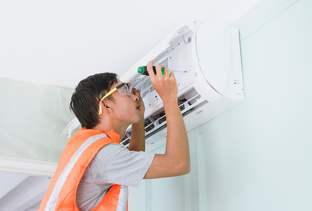 person fixing an air conditioner