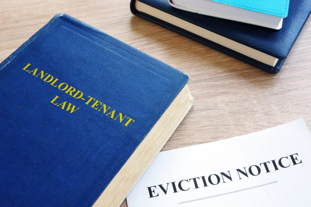 Landlord-Tenant Lawbook Next to an Eviction Notice