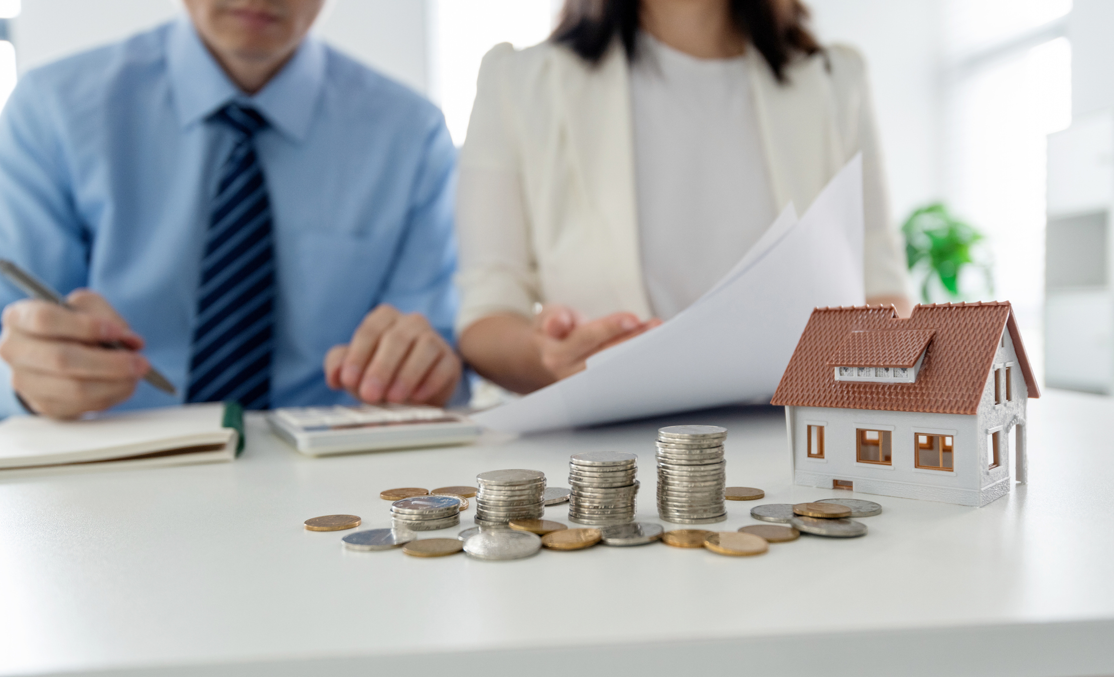 Asset managers working in an office on a real estate portfolio.
