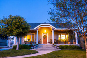 A Craftsman Bungalow home with a fresh coat of paint in twilight.
