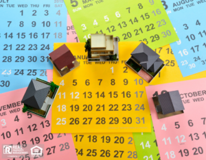 A vibrant assortment of house numbers arranged on a calendar, showcasing various colors and styles.