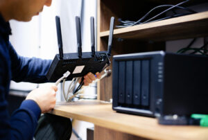 Man preparing cables for small internet network. 