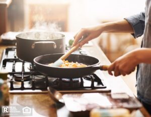 Cropped shot of a woman preparing a meal at home.