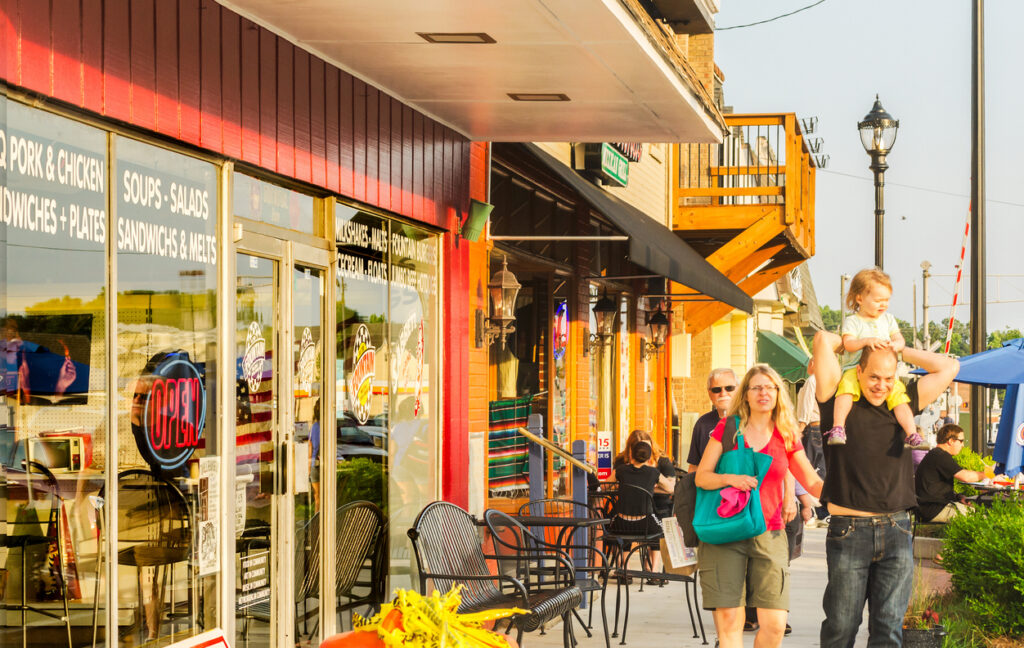 Tucker Property Management Tucker, Georgia, USA - May 22, 2014: People walk down Main Street during the Tucker Farmers Market in downtown Tucker, Georgia.