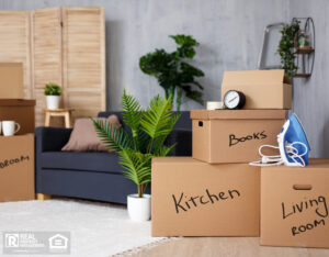Moving boxes with labels in a home.