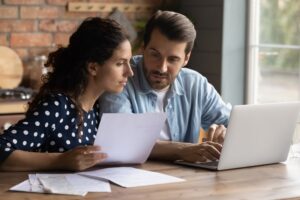 Couple reviewing tenant applications.