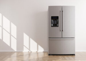 Refrigerator standing in empty room. 