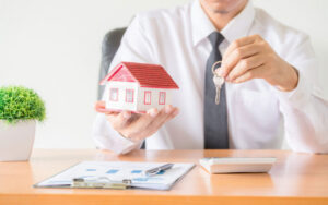 Property manager inspecting an Orange County rental home while planning a maintenance budget.