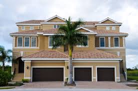 Real estate investor reviewing an Orange County rental property with a property manager.