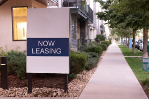 Now leasing sign outside of a rental property