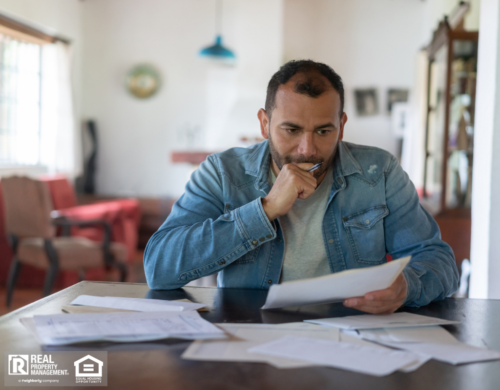 Worried Individual Reviewing Finances Ft