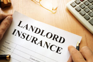 Landlord insurance papers on a desk. 