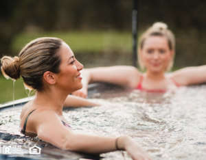 Young Women Relaxing in Hot Tub on Rental Property