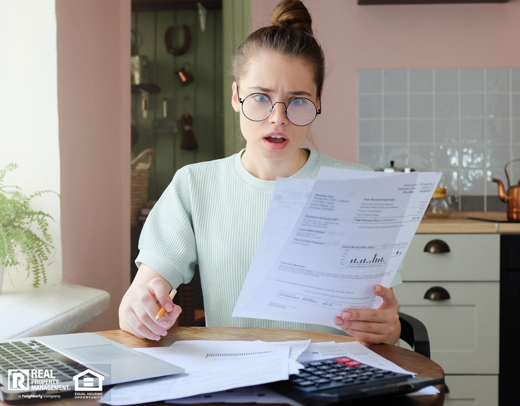 Shocked Woman Looking At Electricity Bill
