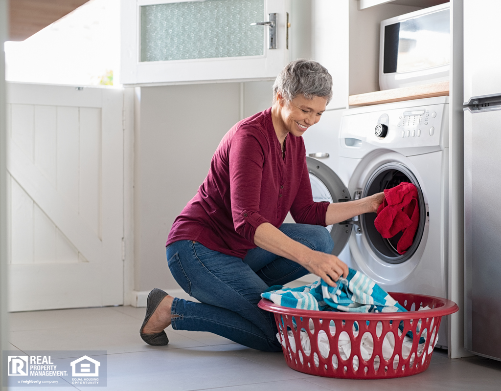 Older Woman Doing Laundry with a New Appliance