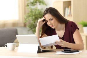 Frustrated Investor Looking at Paperwork