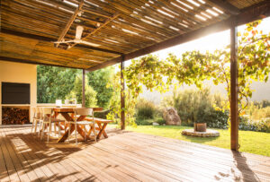 furnished patio looking out into yard with a garden