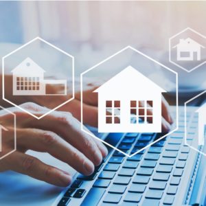 House Icons Floating Above a Keyboard