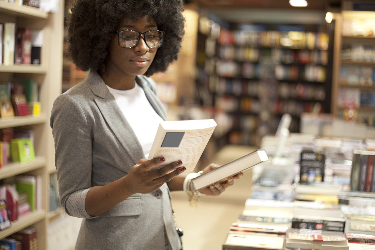 Business Woman Buying Book at Book Store