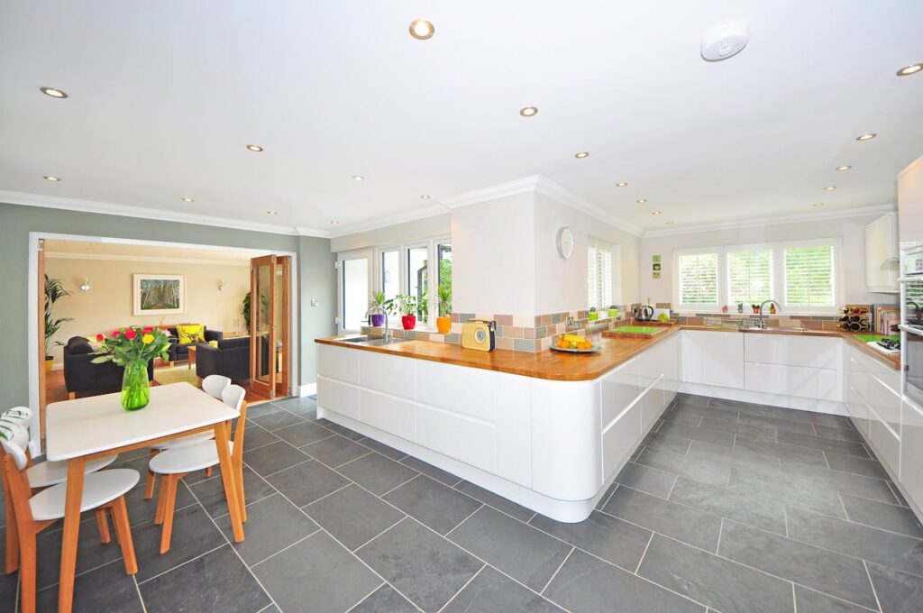 grey floors, white island home interior
