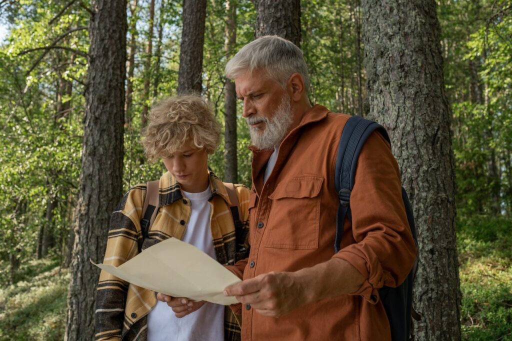 people looking at a map on trail